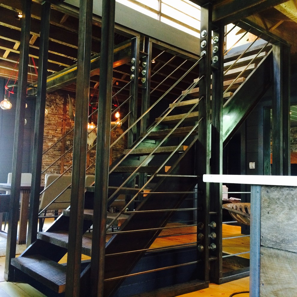 Industrial wood staircase in Philadelphia with metal risers.