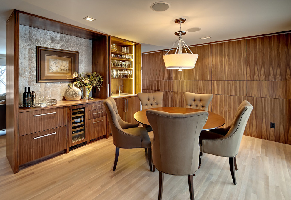 This is an example of a contemporary dining room in Minneapolis with light hardwood floors.