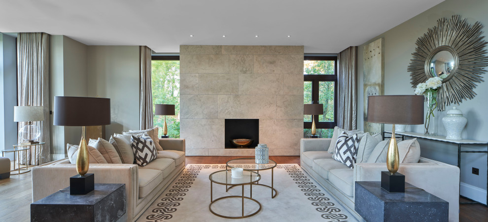 Expansive contemporary formal open concept living room in Dublin with grey walls, medium hardwood floors, a ribbon fireplace, a tile fireplace surround and brown floor.