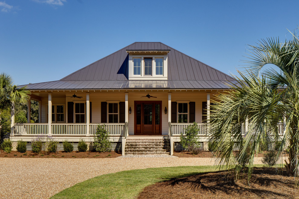 Small tropical two-storey exterior in Atlanta with a hip roof.
