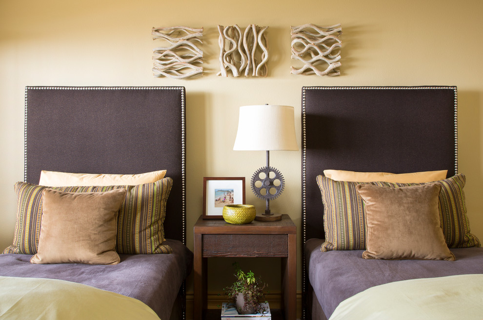 Transitional guest bedroom in Denver with beige walls.