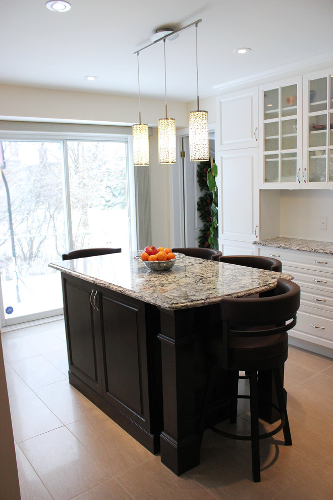 Modern kitchen in Ottawa with an undermount sink, beaded inset cabinets, white cabinets, quartzite benchtops, brown splashback, ceramic splashback, stainless steel appliances, ceramic floors and with island.