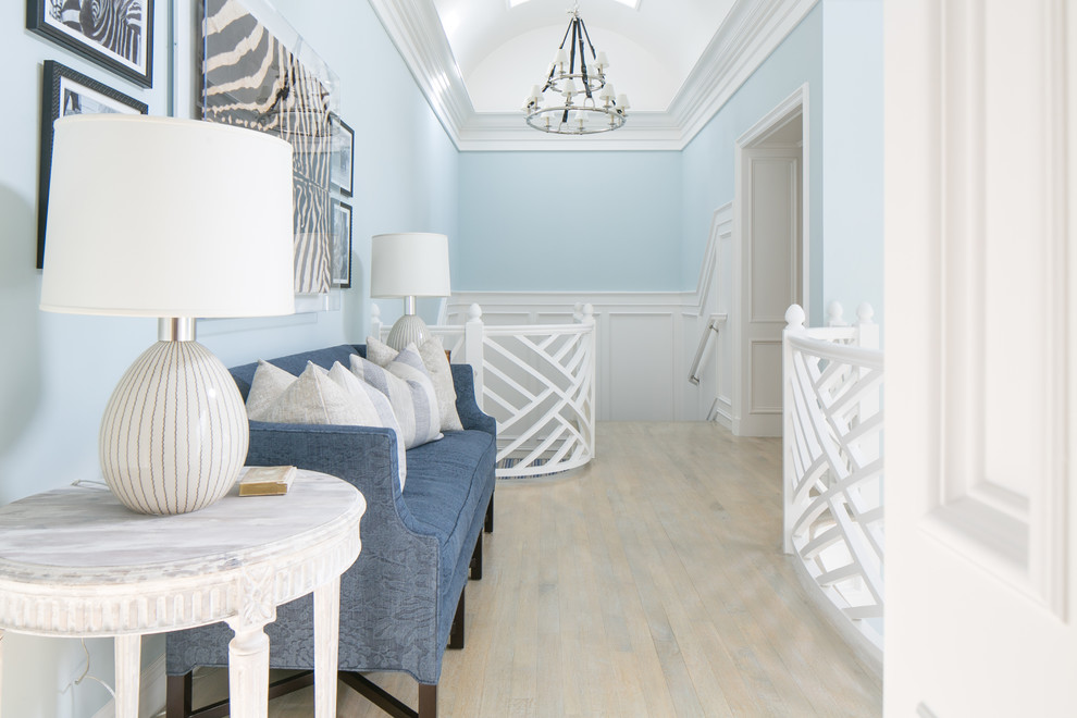 Photo of a transitional hallway in Orange County with blue walls.