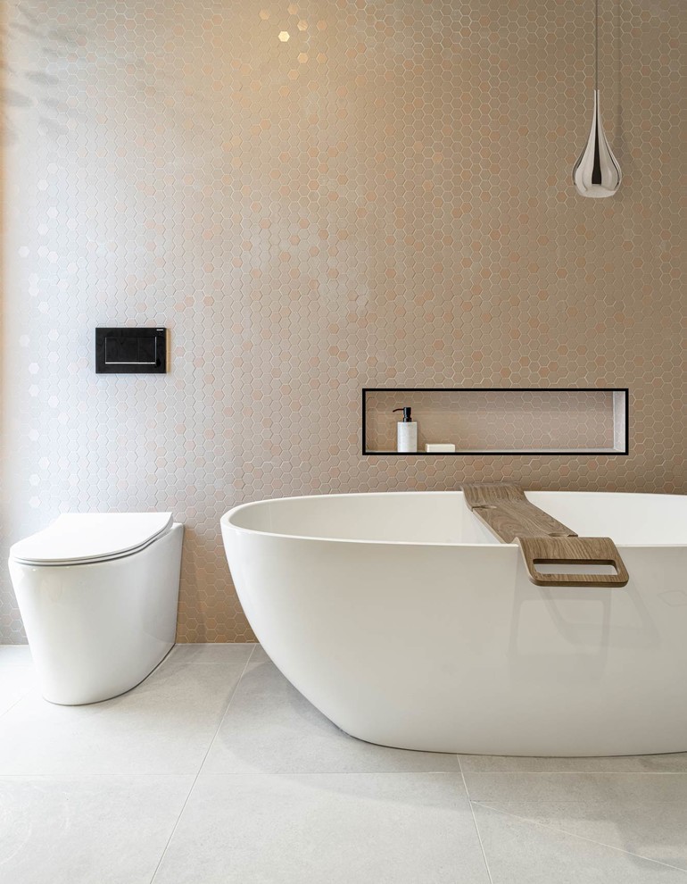 Design ideas for a mid-sized modern master bathroom in Melbourne with flat-panel cabinets, medium wood cabinets, a freestanding tub, a curbless shower, a one-piece toilet, black and white tile, marble, white walls, porcelain floors, a vessel sink, solid surface benchtops, grey floor, an open shower and white benchtops.