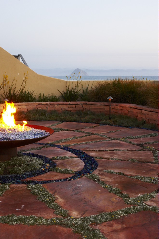Beach style patio in San Luis Obispo with a fire feature.