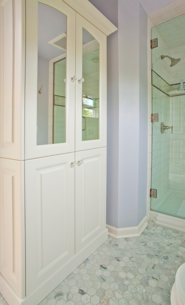 Design ideas for a small traditional 3/4 bathroom in Seattle with an undermount sink, raised-panel cabinets, white cabinets, engineered quartz benchtops, an alcove shower, a two-piece toilet, gray tile, subway tile, blue walls and marble floors.