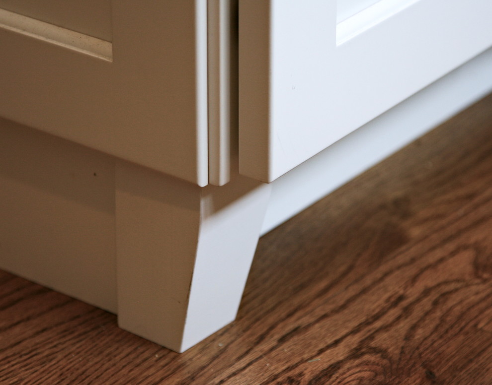 Inspiration for a large transitional medium tone wood floor kitchen remodel in Cincinnati with an undermount sink, flat-panel cabinets, white cabinets, quartz countertops, gray backsplash, porcelain backsplash, stainless steel appliances and an island