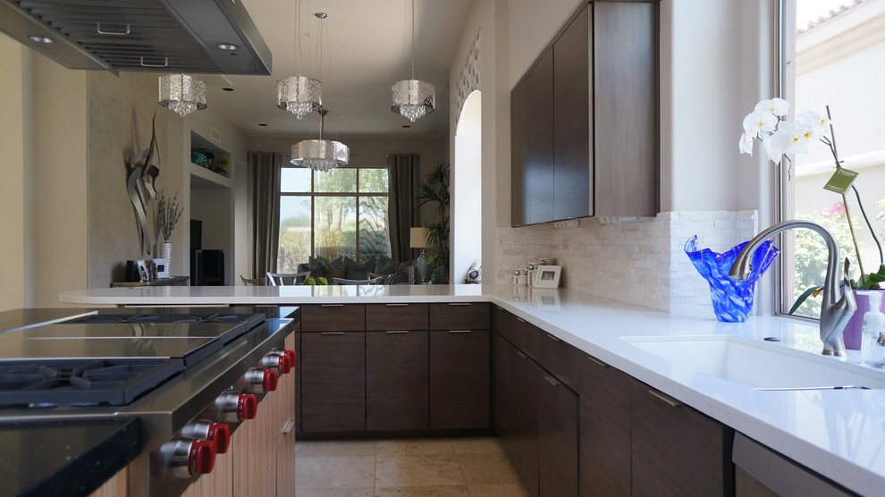 Open concept kitchen - mid-sized transitional u-shaped travertine floor and beige floor open concept kitchen idea in Phoenix with a single-bowl sink, flat-panel cabinets, dark wood cabinets, quartz countertops, white backsplash, stone tile backsplash, stainless steel appliances and an island