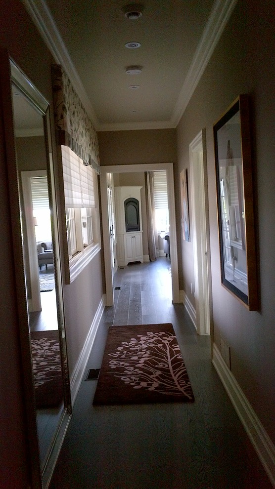 Example of a large transitional dark wood floor home design design in Toronto with beige walls