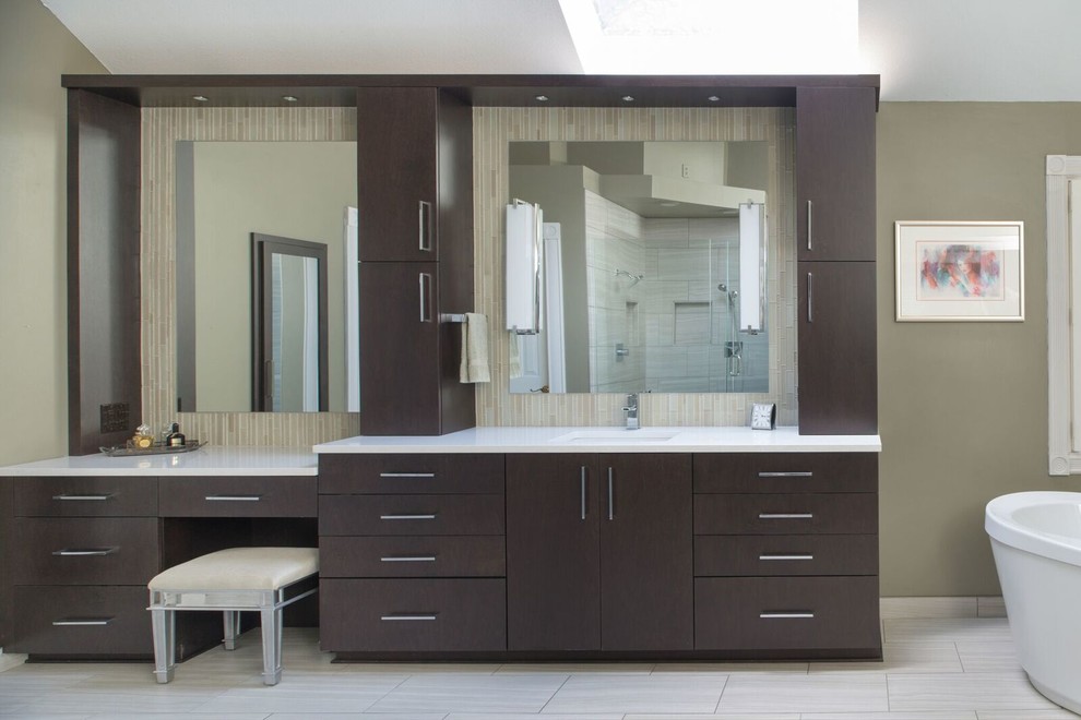 Large modern master bathroom in Orange County with a freestanding tub, a corner shower, flat-panel cabinets, brown cabinets, beige tile, gray tile, matchstick tile, grey walls, laminate floors, an undermount sink, laminate benchtops and grey floor.
