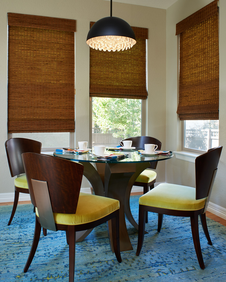 Transitional medium tone wood floor dining room photo in Denver with beige walls