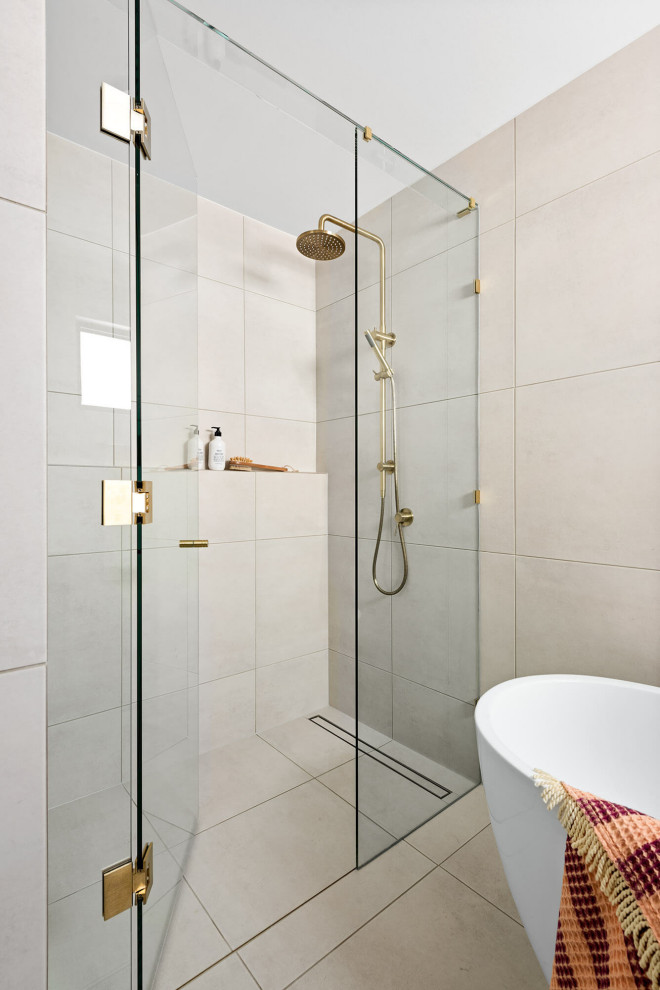 Photo of a medium sized modern family bathroom in Melbourne with flat-panel cabinets, dark wood cabinets, a freestanding bath, a built-in shower, a wall mounted toilet, white tiles, stone tiles, white walls, ceramic flooring, a vessel sink, engineered stone worktops, white floors, a hinged door, white worktops, double sinks and a floating vanity unit.