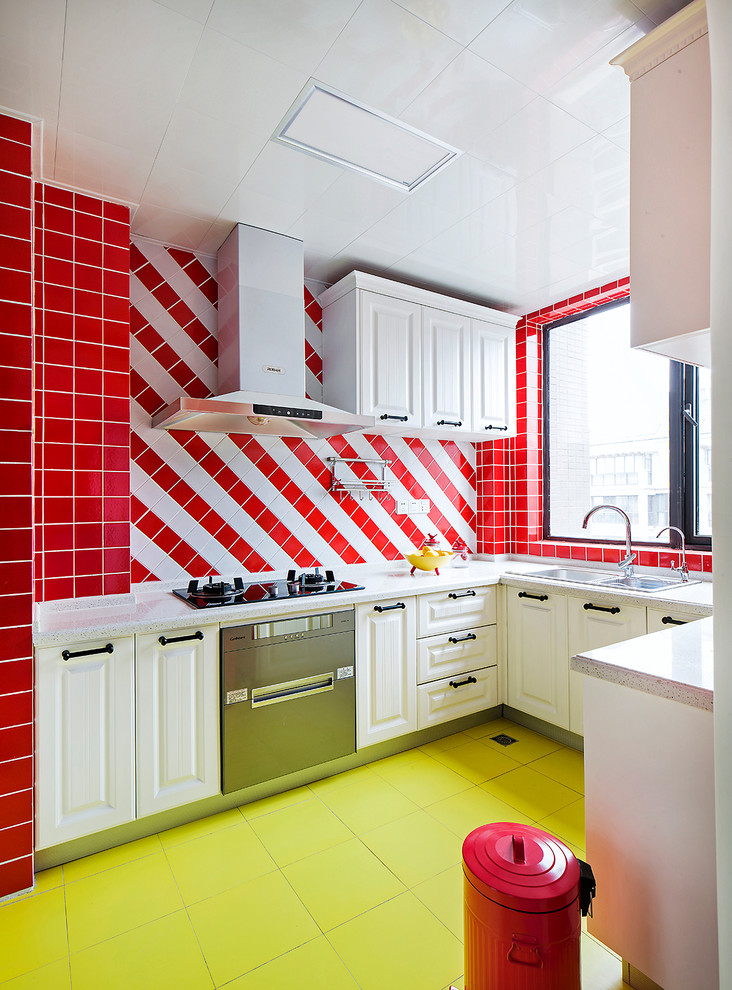 Eclectic u-shaped kitchen in Other with a double-bowl sink, raised-panel cabinets, white cabinets, multi-coloured splashback and green floor.