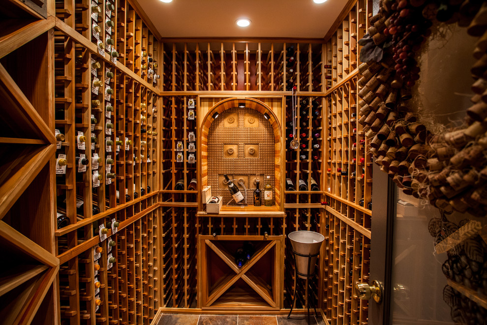 Mid-sized contemporary wine cellar in DC Metro with travertine floors and storage racks.