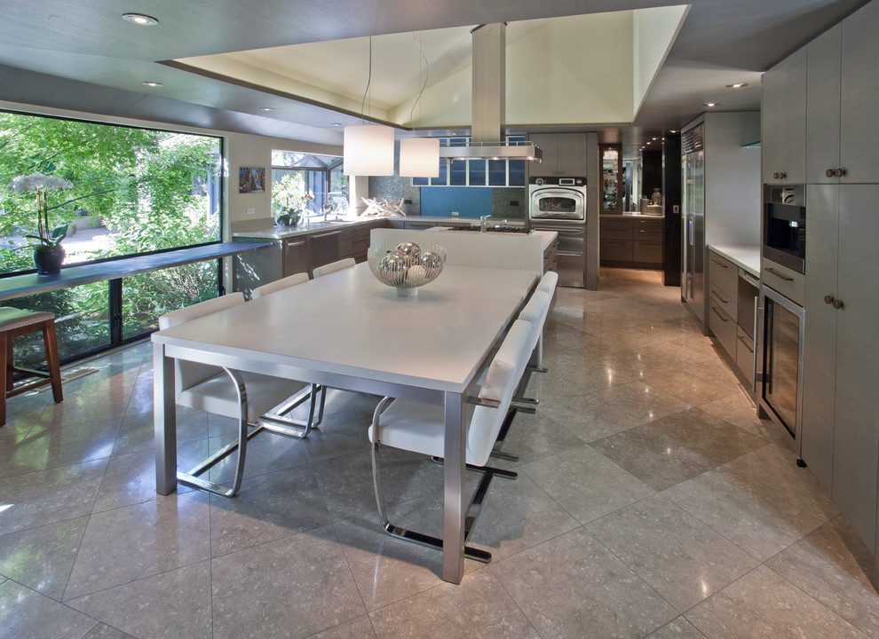 Inspiration for a contemporary u-shaped kitchen in Sacramento with an undermount sink, flat-panel cabinets, beige cabinets, marble benchtops, multi-coloured splashback, mosaic tile splashback, stainless steel appliances and with island.