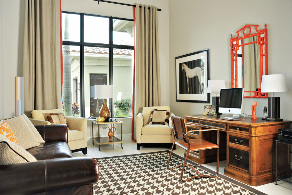 Example of a mid-sized transitional freestanding desk marble floor study room design in Miami with beige walls