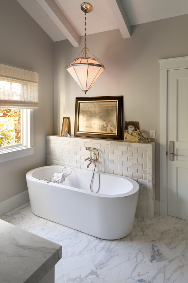 Mid-sized transitional master bathroom in San Diego with an undermount sink, recessed-panel cabinets, white cabinets, marble benchtops, a freestanding tub, an alcove shower, a one-piece toilet, grey walls and marble floors.