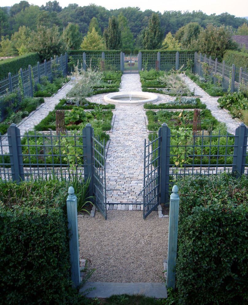 Photo of a large farmhouse backyard stone formal garden in New York.