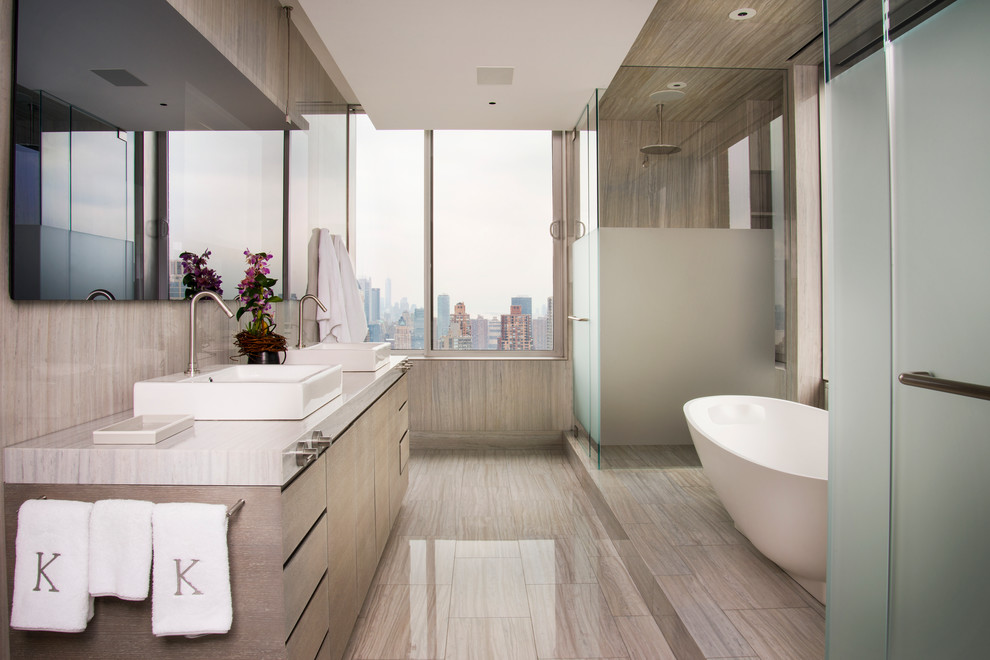 Example of a trendy master freestanding bathtub design in New York with flat-panel cabinets