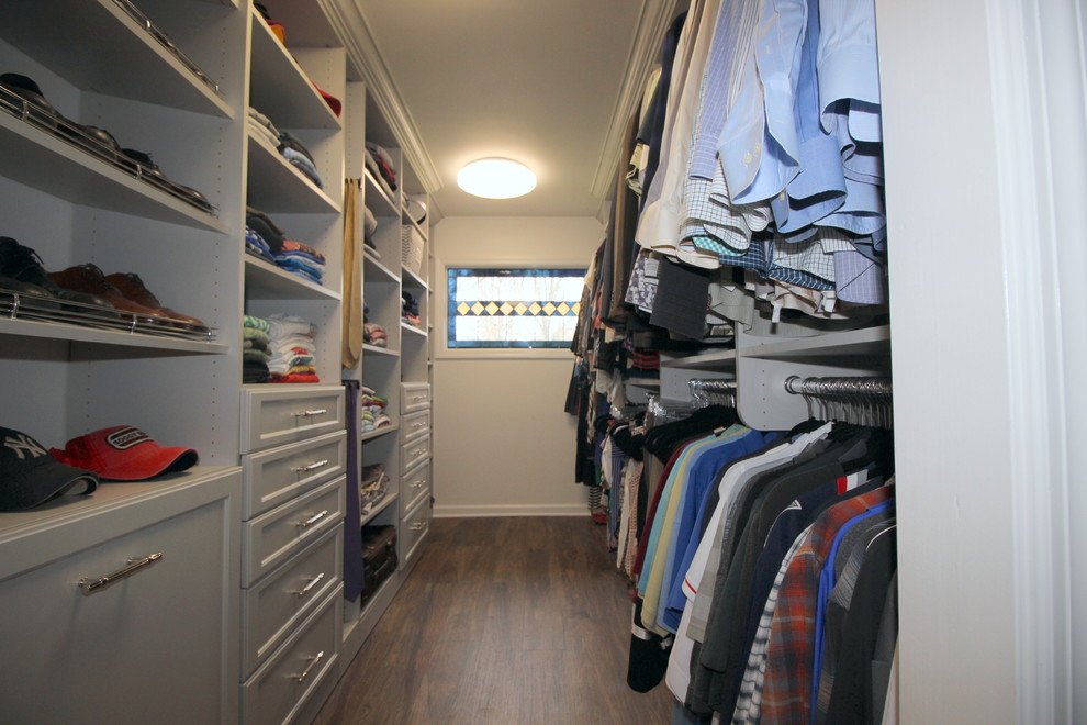 Photo of a large transitional gender-neutral walk-in wardrobe in Other with recessed-panel cabinets, grey cabinets and linoleum floors.