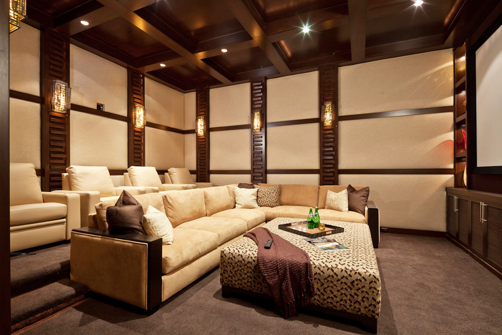Inspiration for a contemporary home theatre in San Diego with a projector screen and grey floor.