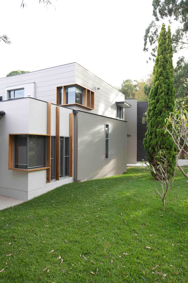 Photo of a large contemporary two-storey concrete exterior in Sydney.