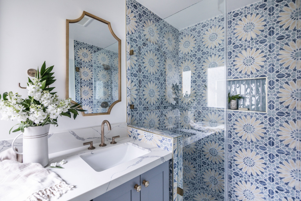 Design ideas for a mediterranean 3/4 bathroom in Orange County with shaker cabinets, blue cabinets, blue tile, ceramic tile, ceramic floors, engineered quartz benchtops, a hinged shower door, white benchtops, a double vanity and a built-in vanity.
