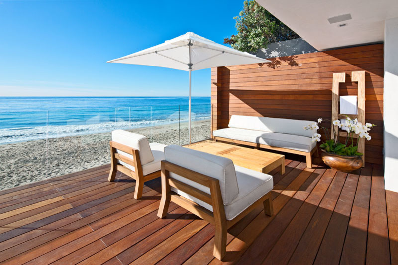 This is an example of a mid-sized modern backyard patio in Los Angeles with decking and no cover.