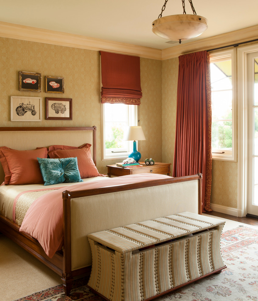 Design ideas for a large mediterranean guest bedroom in Los Angeles with beige walls and dark hardwood floors.
