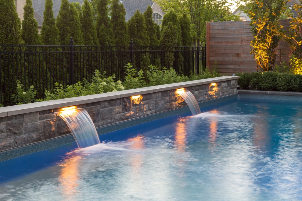Transitional backyard pool photo in Toronto