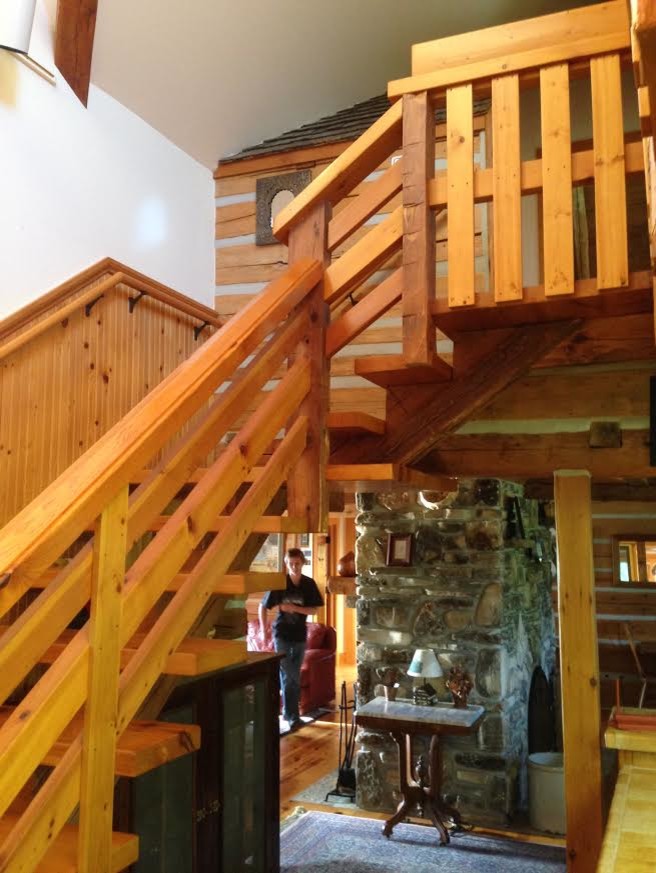 Inspiration for a mid-sized rustic wooden straight open and wood railing staircase remodel