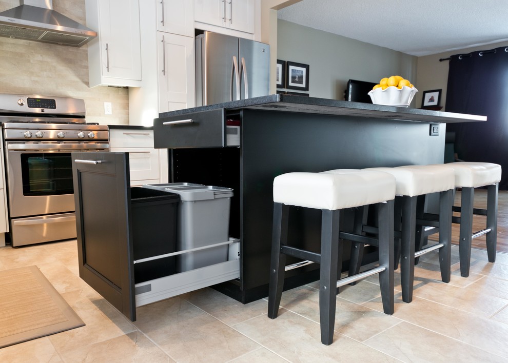 Inspiration for a contemporary l-shaped eat-in kitchen in Ottawa with an undermount sink, shaker cabinets, white cabinets, quartz benchtops, beige splashback, porcelain splashback and stainless steel appliances.