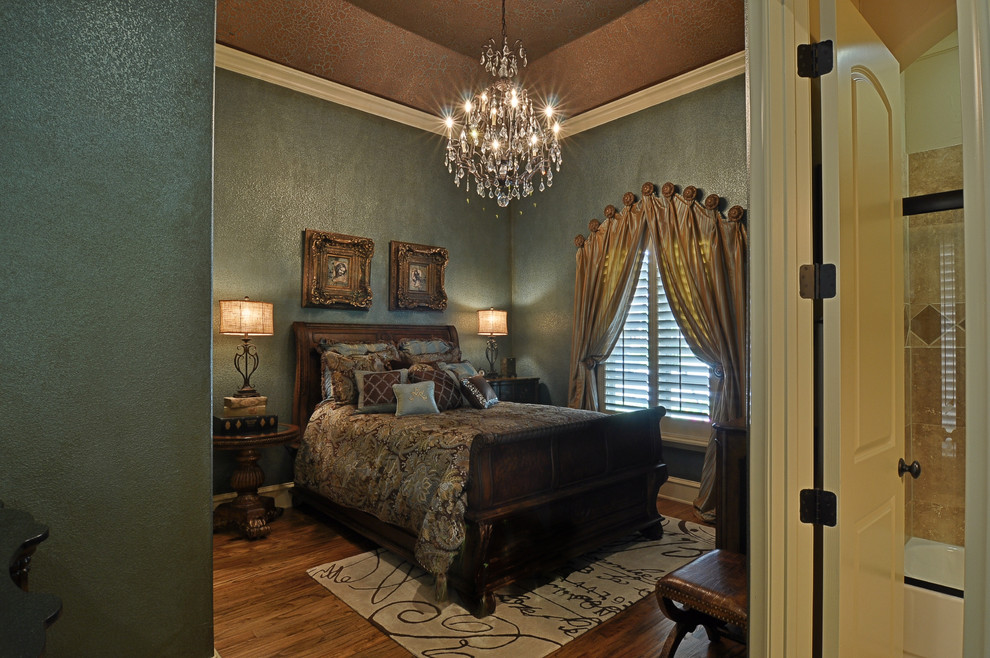 Photo of a large traditional guest bedroom in Dallas with green walls, medium hardwood floors and no fireplace.