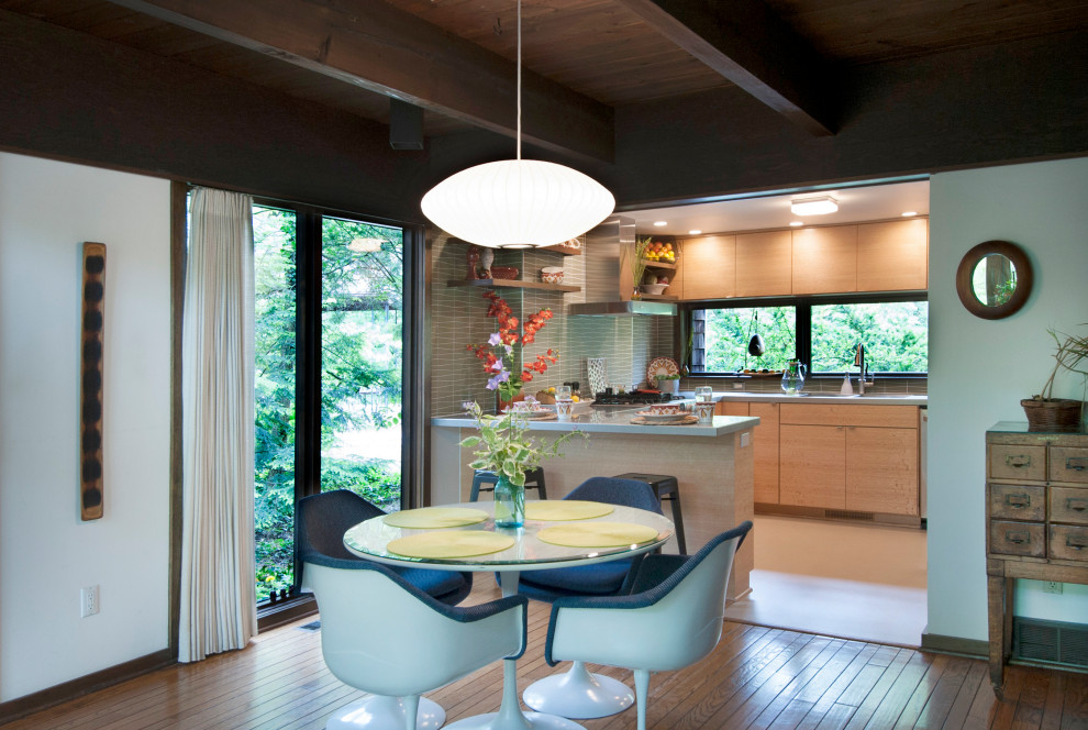 This is an example of a midcentury dining room in Columbus.