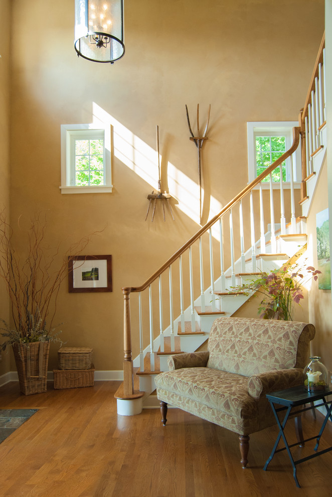 Photo of a country entryway in Cincinnati with beige walls.