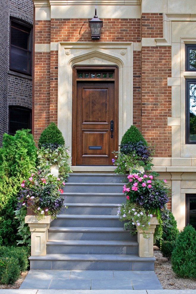Inspiration for an expansive traditional three-storey brick brown exterior in Chicago.