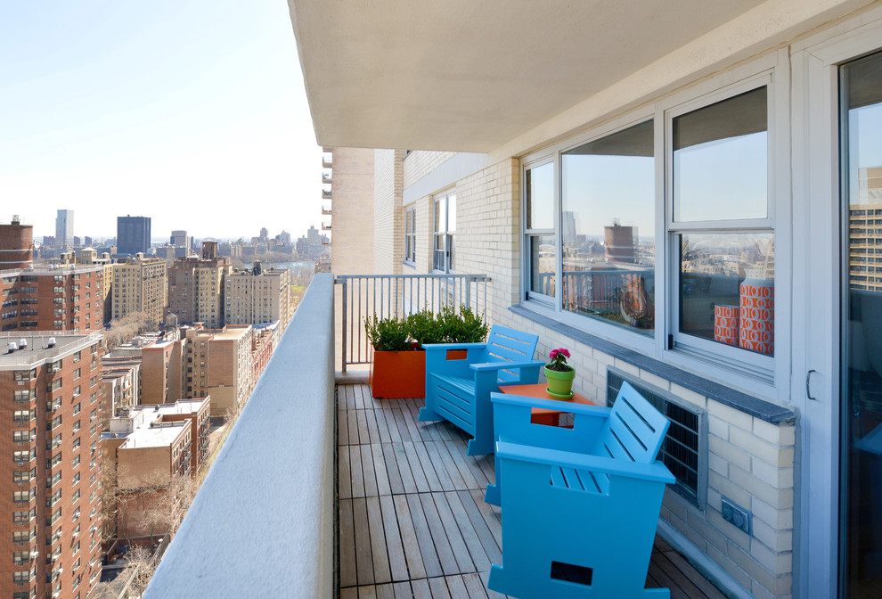 Balcony - small contemporary side yard balcony idea in New York with a roof extension