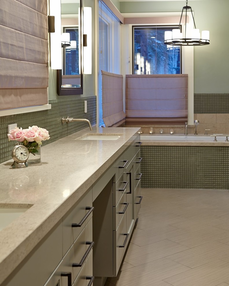 Large contemporary master bathroom in San Francisco with flat-panel cabinets, green cabinets, an undermount tub, a corner shower, beige tile, green walls, porcelain floors, an undermount sink and limestone benchtops.