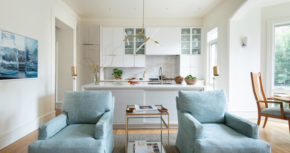 Inspiration for a mid-sized modern galley eat-in kitchen in DC Metro with a single-bowl sink, flat-panel cabinets, light wood cabinets, marble benchtops, grey splashback, marble splashback, stainless steel appliances, dark hardwood floors, with island, brown floor and white benchtop.