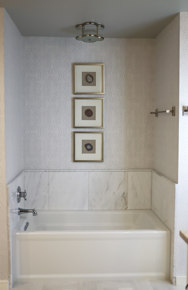 Mid-sized transitional master white tile and marble tile ceramic tile and gray floor alcove bathtub photo with gray walls, beaded inset cabinets, white cabinets, a two-piece toilet, an undermount sink, quartzite countertops and a hinged shower door