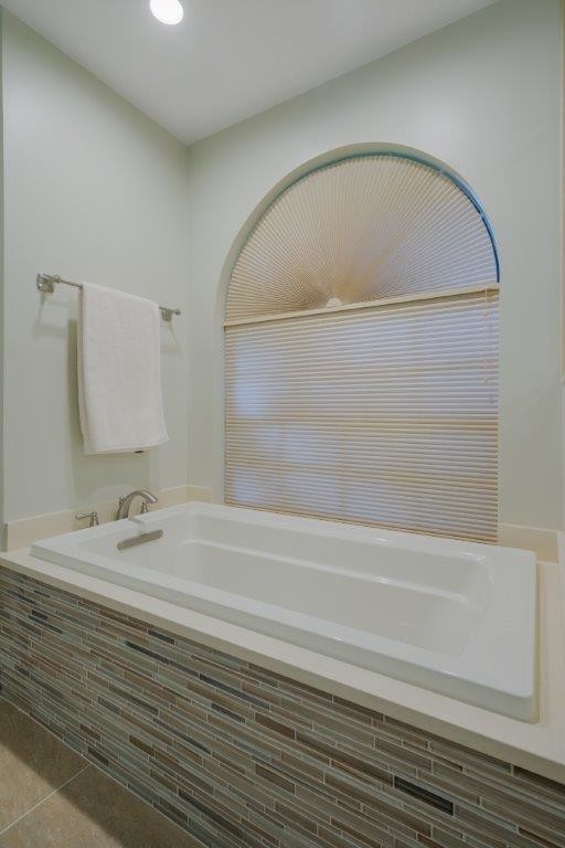 Transitional beige tile and porcelain tile porcelain tile home design photo in Miami with shaker cabinets, medium tone wood cabinets, a two-piece toilet, an undermount sink and quartz countertops