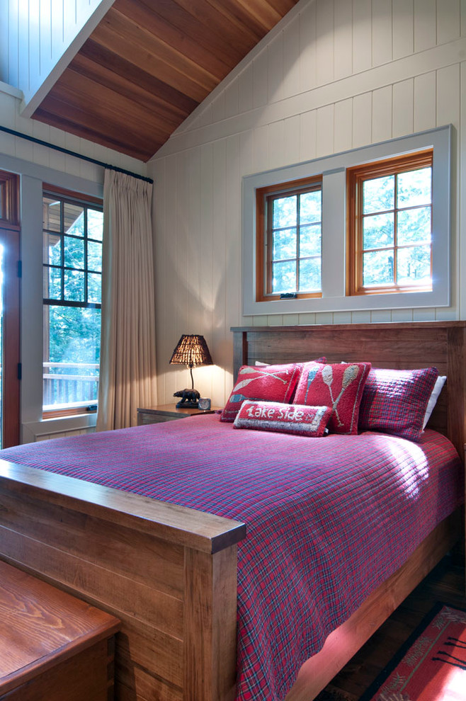 This is an example of a country bedroom in Toronto with white walls.