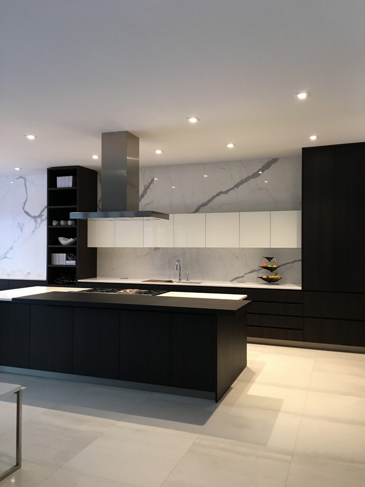Design ideas for a large contemporary single-wall open plan kitchen in Other with flat-panel cabinets, white cabinets, grey splashback, stone slab splashback, panelled appliances, ceramic floors and with island.
