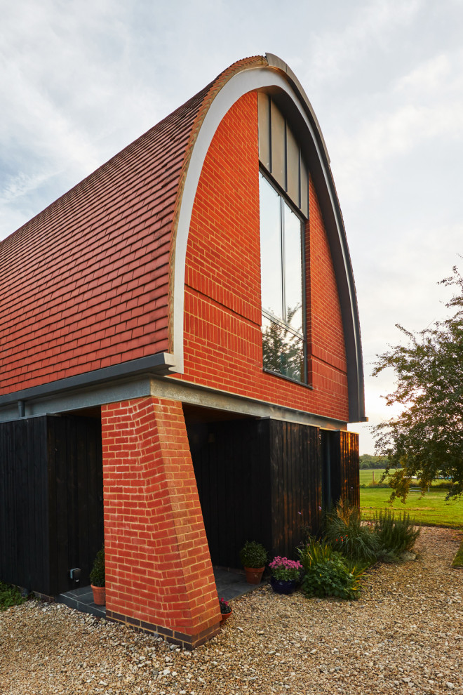 Design ideas for a modern brick detached house in Oxfordshire with an orange house.