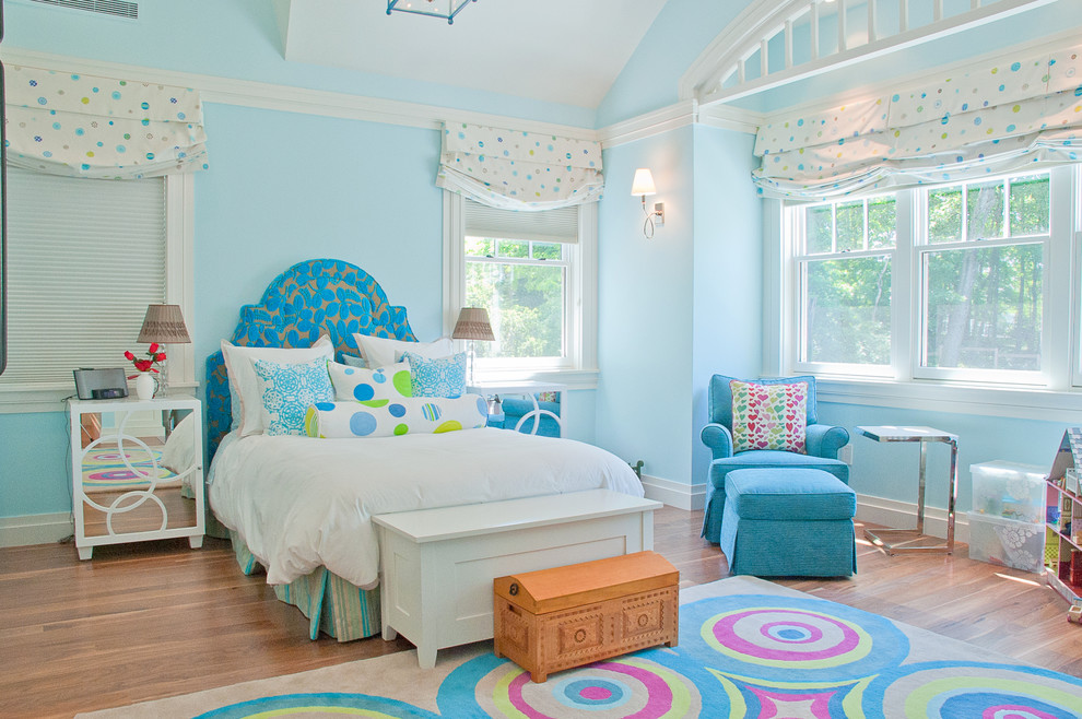 Transitional kids' room in Boston with blue walls.