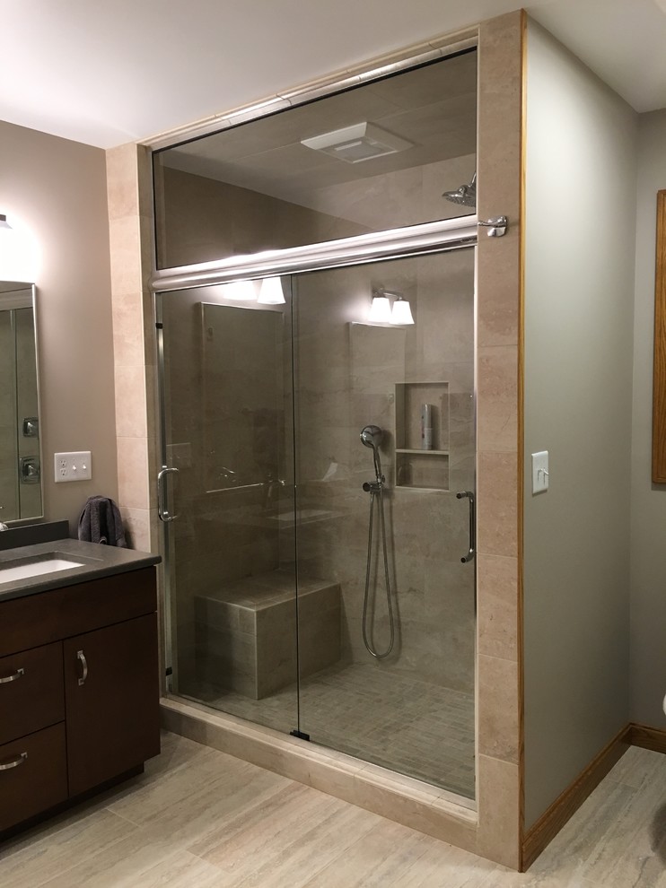 Large transitional master beige tile and porcelain tile porcelain tile alcove shower photo with flat-panel cabinets, dark wood cabinets, a two-piece toilet, green walls, an undermount sink and quartz countertops