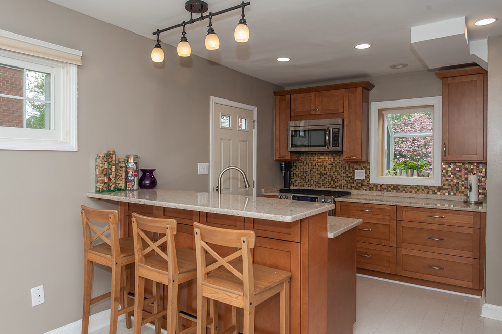 Large transitional galley cork floor eat-in kitchen photo in DC Metro with an undermount sink, shaker cabinets, brown cabinets, quartz countertops, multicolored backsplash, glass tile backsplash and stainless steel appliances