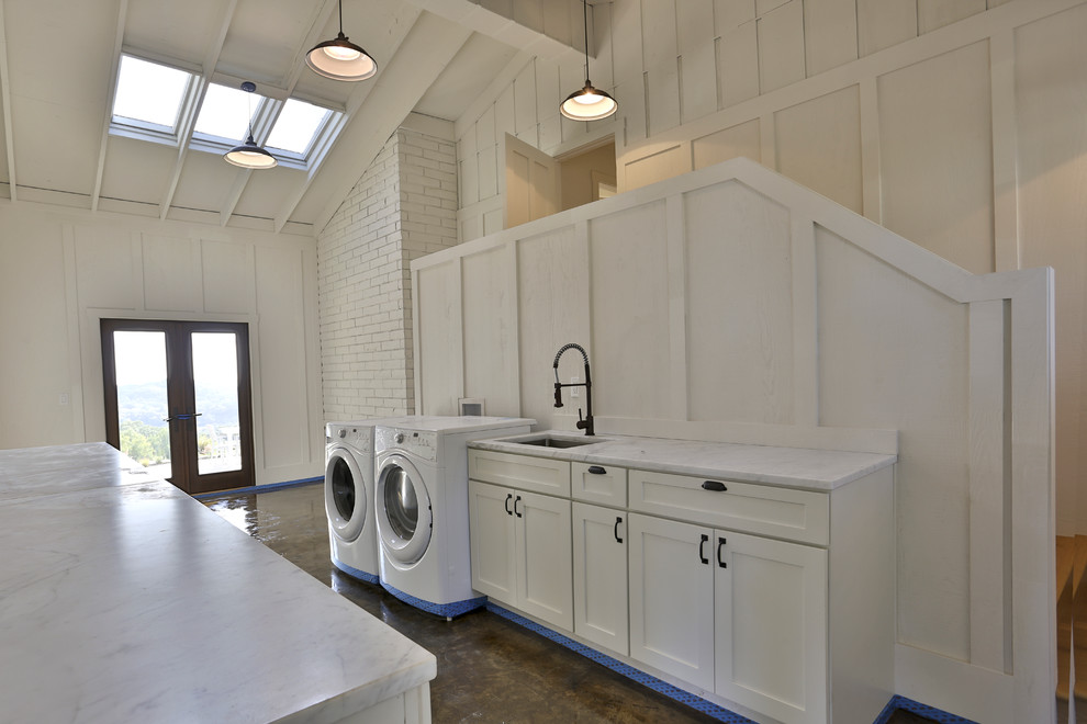 Design ideas for a mid-sized country galley utility room in San Francisco with a drop-in sink, white cabinets, granite benchtops, white walls, ceramic floors, a side-by-side washer and dryer and shaker cabinets.
