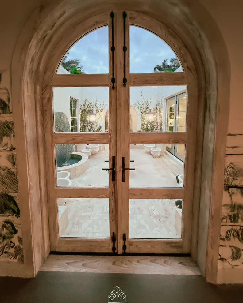 Inspiration for a mid-sized rustic ceramic tile, beige floor, coffered ceiling and brick wall double front door remodel in Miami with beige walls and a brown front door