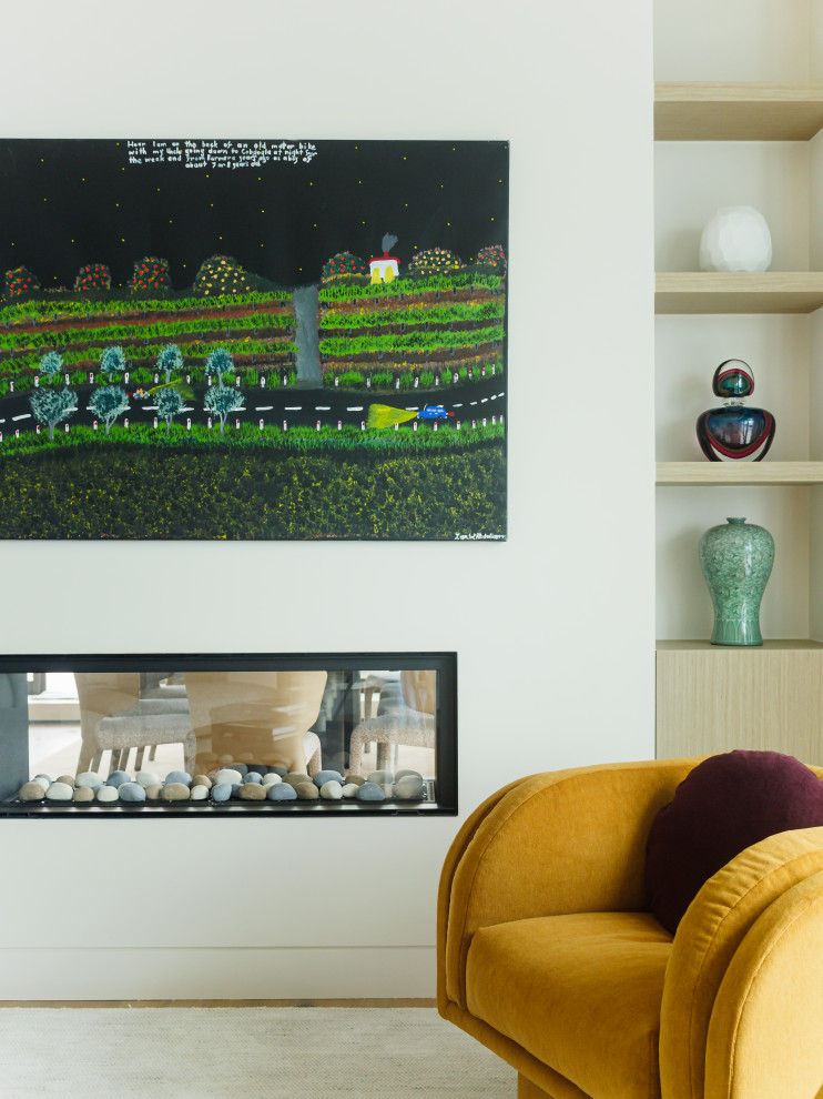 Design ideas for a contemporary open concept living room in Melbourne with a plaster fireplace surround, a wall-mounted tv and multi-coloured floor.